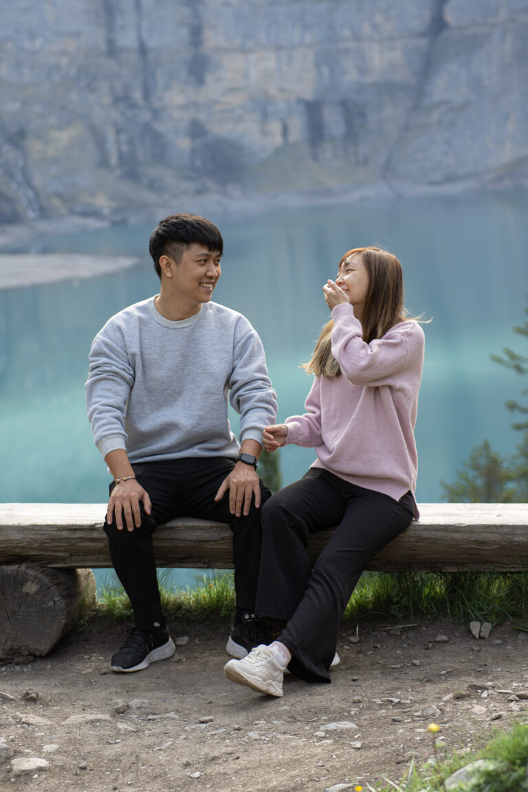 Fun asian couple photos near Oeschinensee in Switzerland