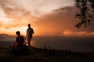 Couple enjoying a glass of prosecco during a photoshoot at sunset near Montreux