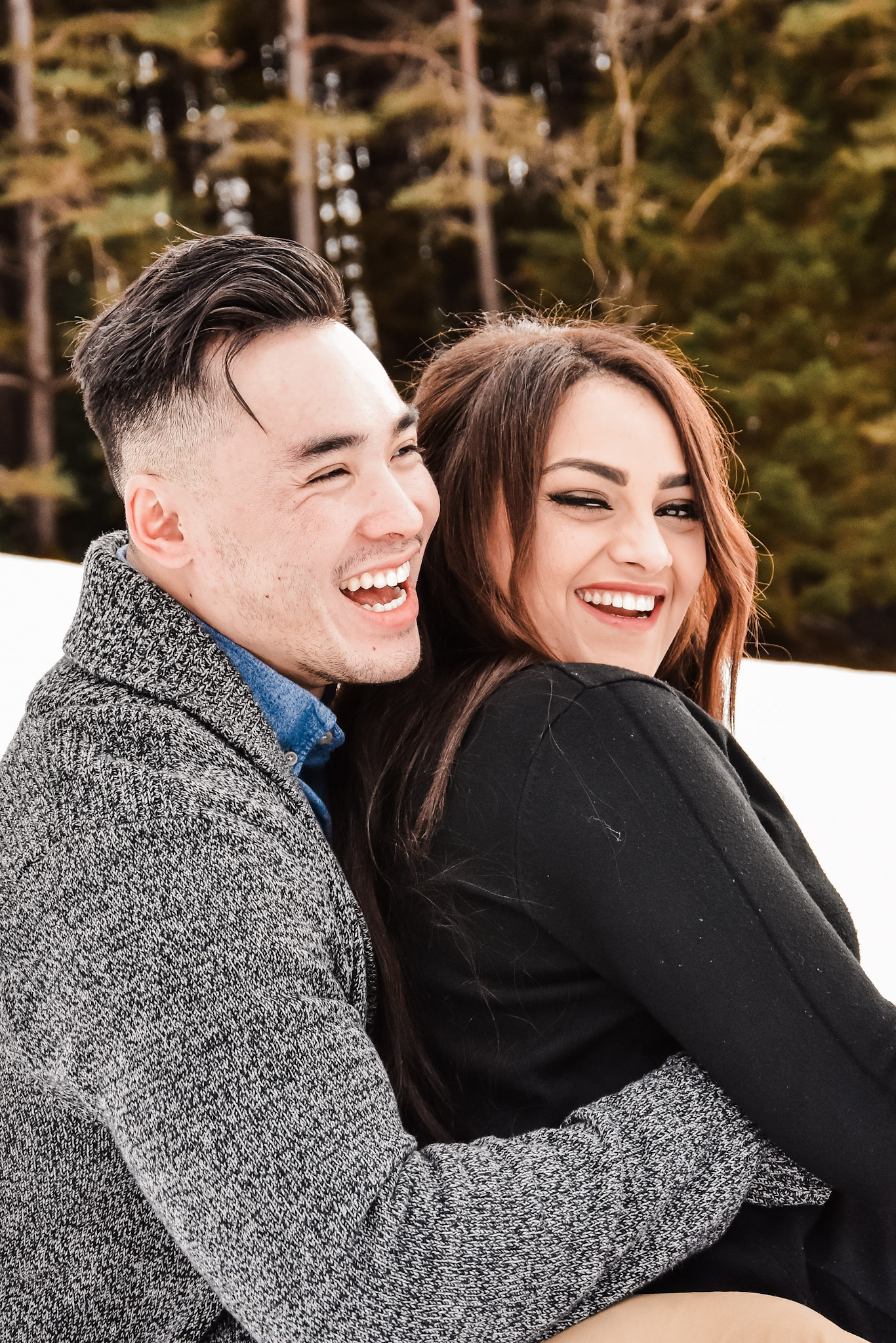 Couple enjoying a relaxed and natural moment together during an outdoor session in Switzerland