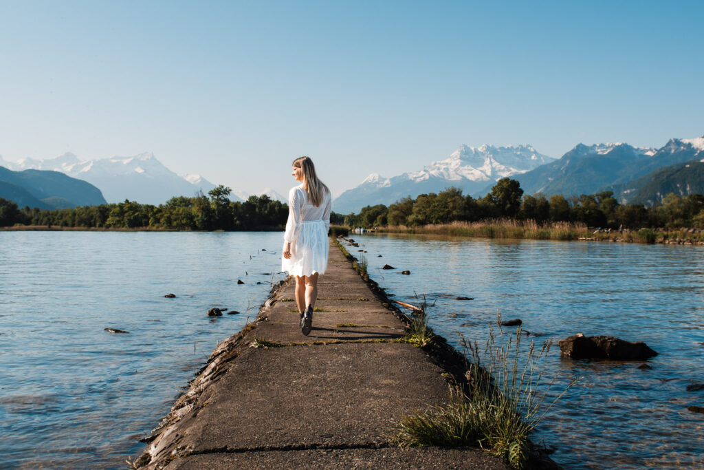 Woman walking during a photoshoot by lake geneva