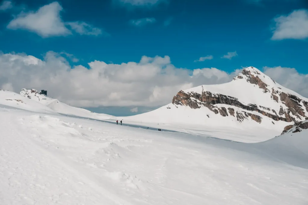 people hiking on a glacier in winter near the Swiss Riviera