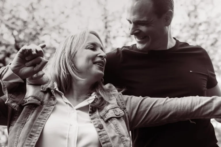black and white portrait of husband looking at his wife