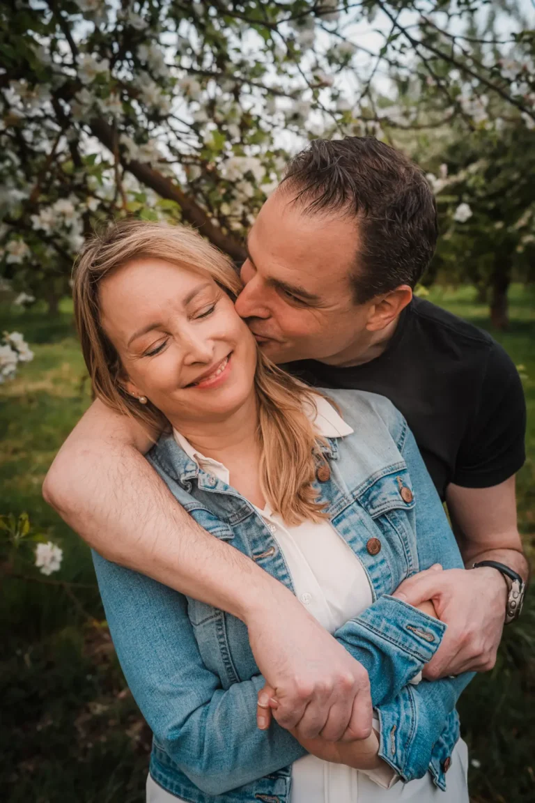 husband hugging and kissing his wife