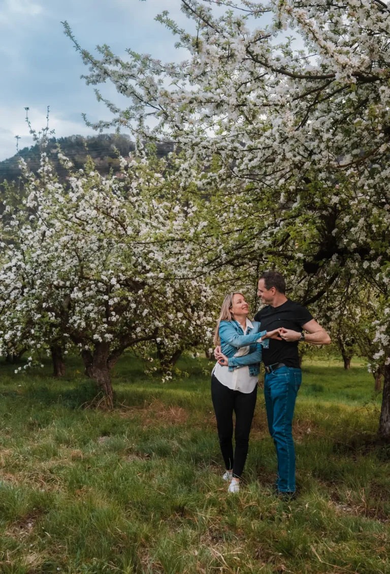 couple dancing in an apple orchard