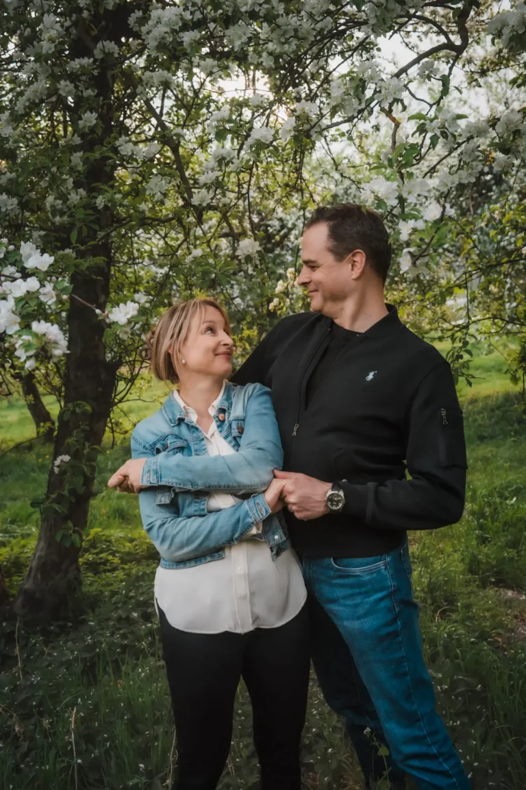 couple looking at eachother mischief way during portrait session