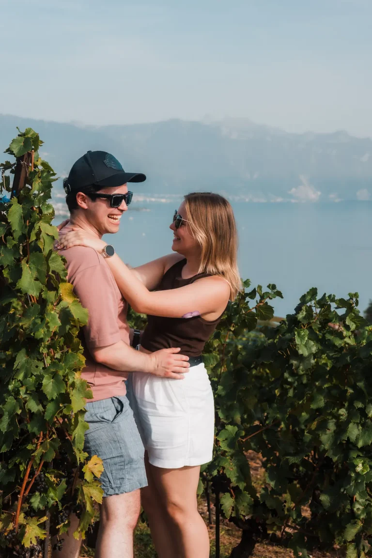Candid photograph of Dimitris and Alisa laughing during their Lavaux engagement portraits.
