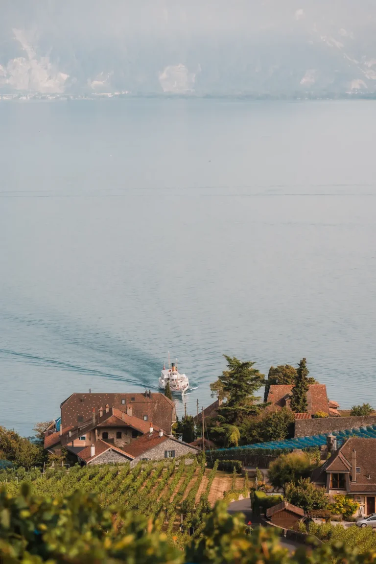 lake geneva boat arriving in lavaux vineyards