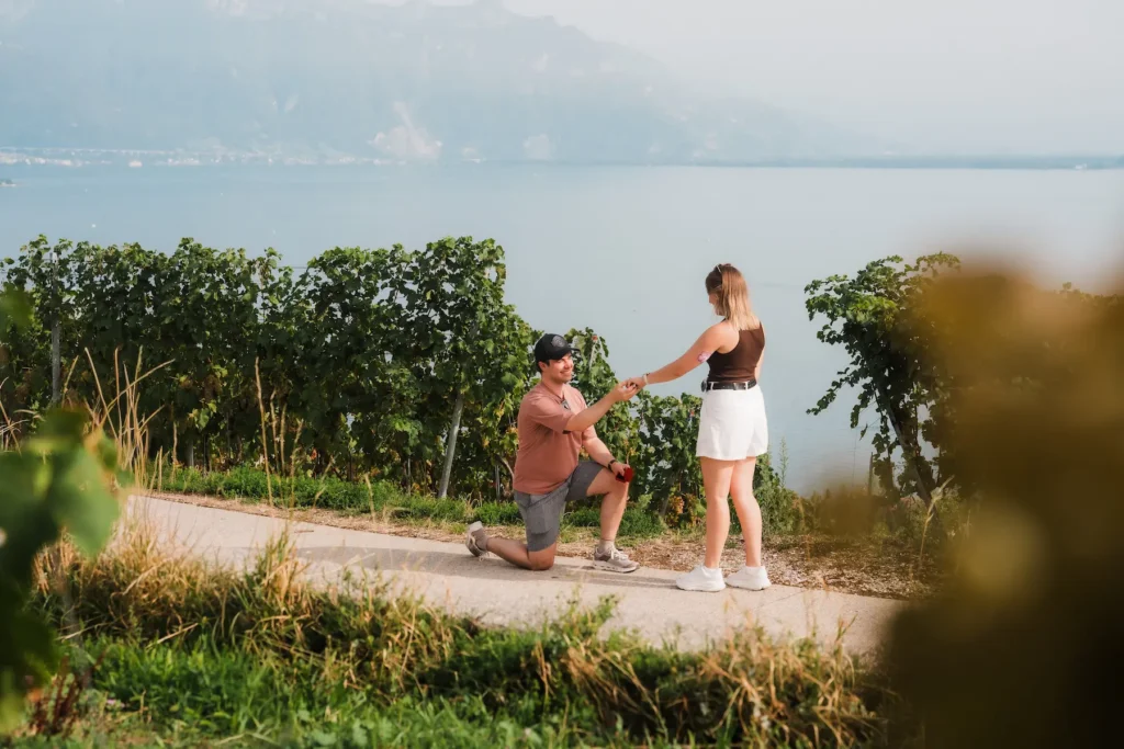Dimitris preparing to propose to Alisa among the Lavaux vineyards overlooking Lake Geneva