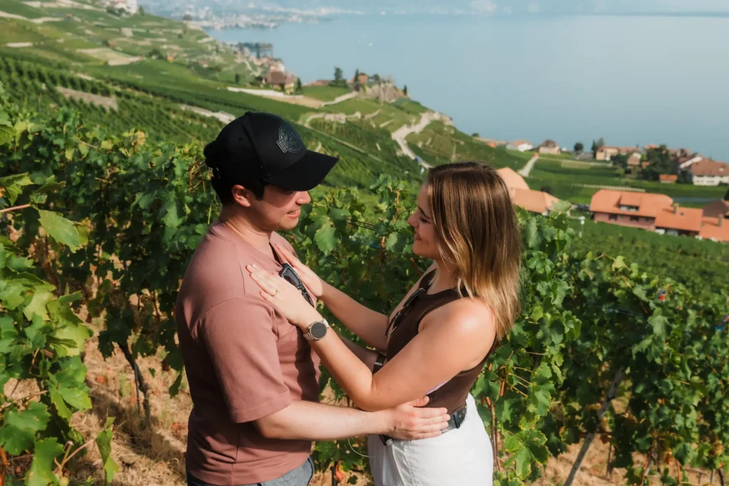 Dimitris and Alisa looking at eachother in the Lavaux vineyards after their surprise proposal.