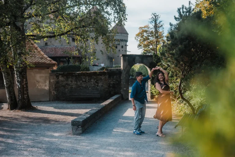 Romantic candid portrait of a couple beside Chillon Castle near Montreux