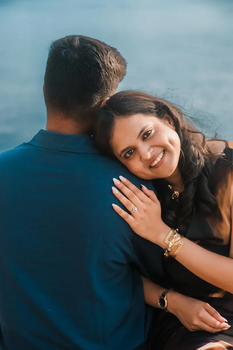 Newly engaged couple sharing a quiet moment beside Lake Geneva