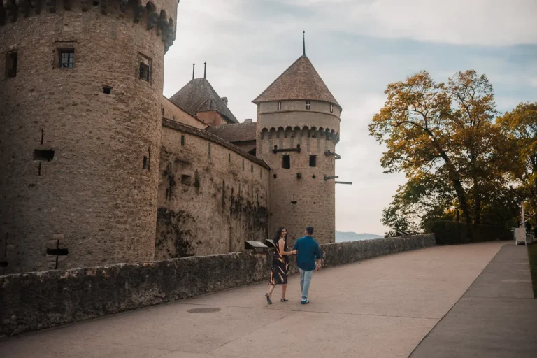 Couple walking together during a relaxed photo session at Chillon Castle